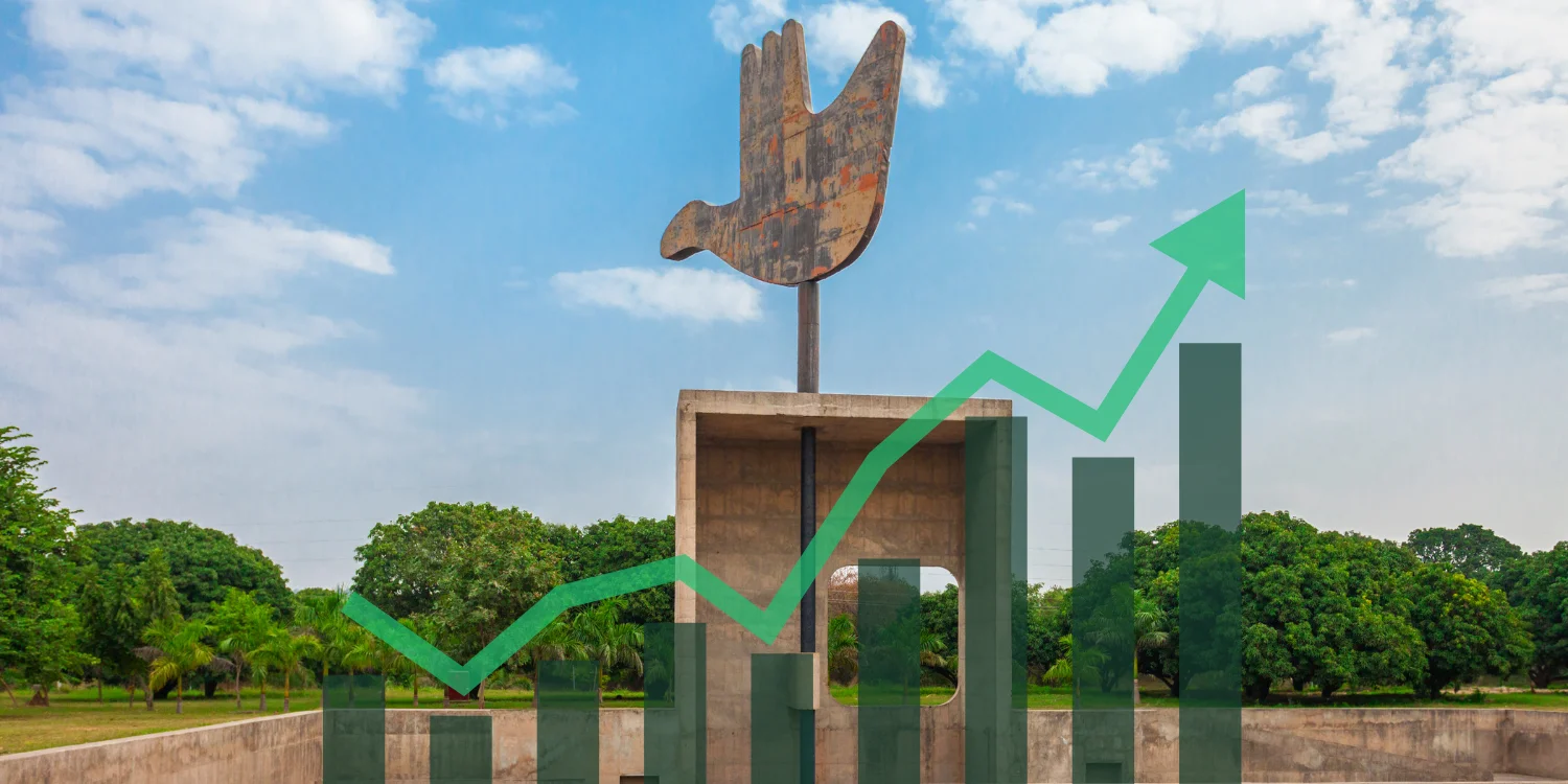The Open Hand Monument in Chandigarh with a growth chart overlay symbolizing business success and digital innovation.
