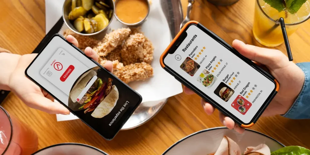 People using mobile apps to browse restaurant options and order food online, showcasing digital marketing and performance-based advertising in the food industry.